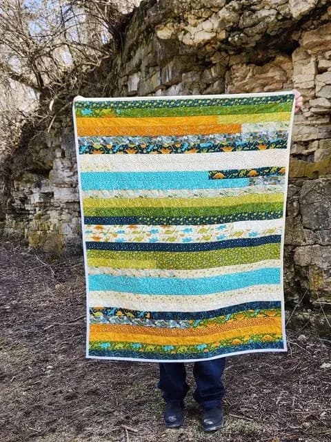 Stomp Stomp Roar Jelly Roll Race Quilt